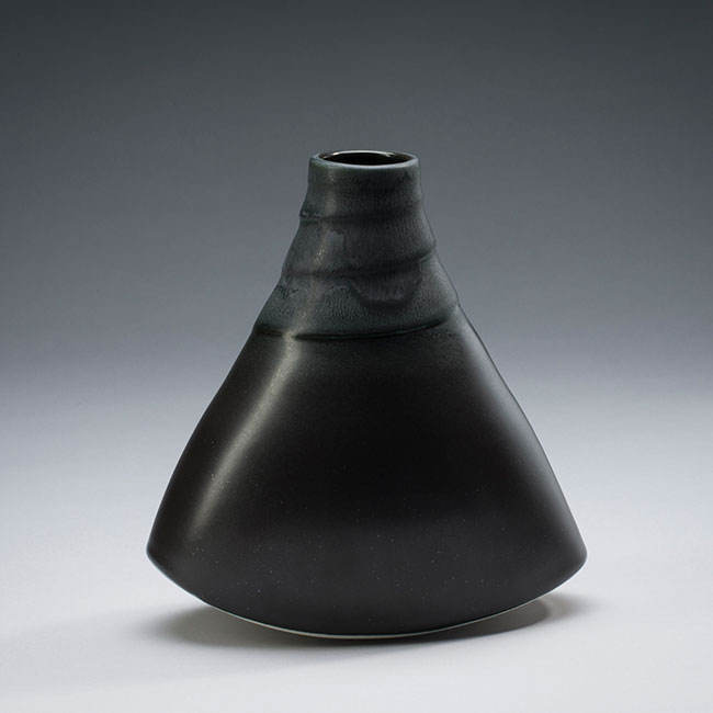 hand-thrown porcelain vessel with black semi-mat and crystaline glaze