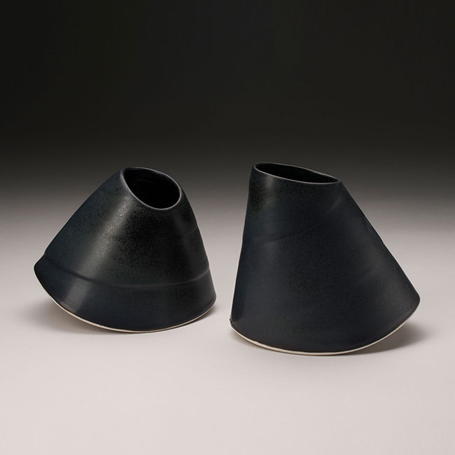 hand-thrown and altered porcelain clay vessels with black matt glaze