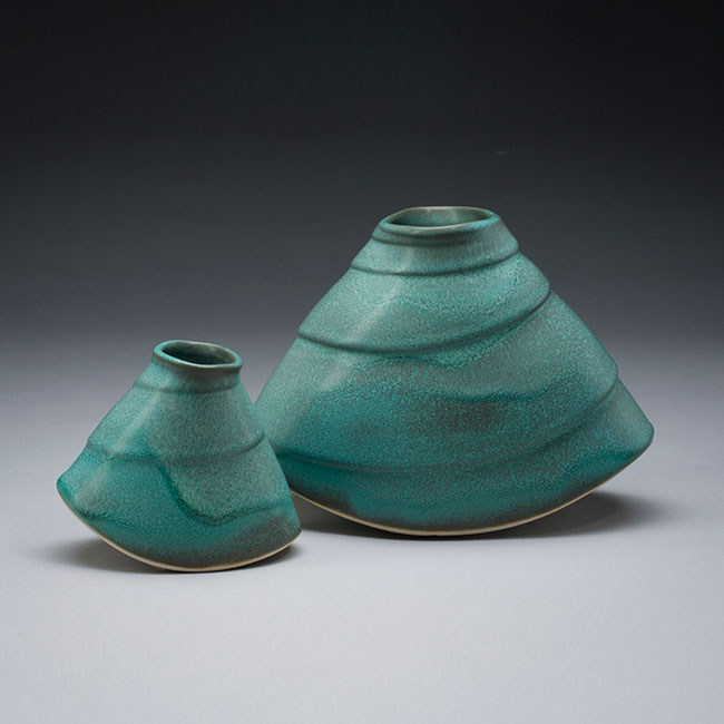 hand-thrown vessels with green mat glaze