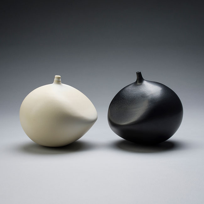 hand-thrown porcelain clay vessels with black and white mat glaze